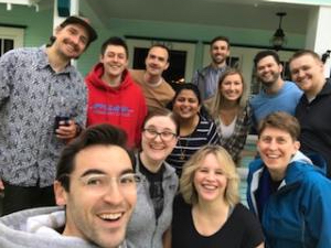 A group of people smiling for their photo